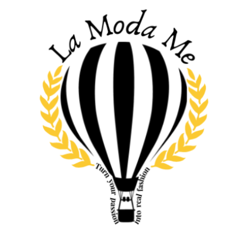 La Moda Me logo featuring a black hot air balloon framed by golden laurel leaves, displayed on a transparent background.